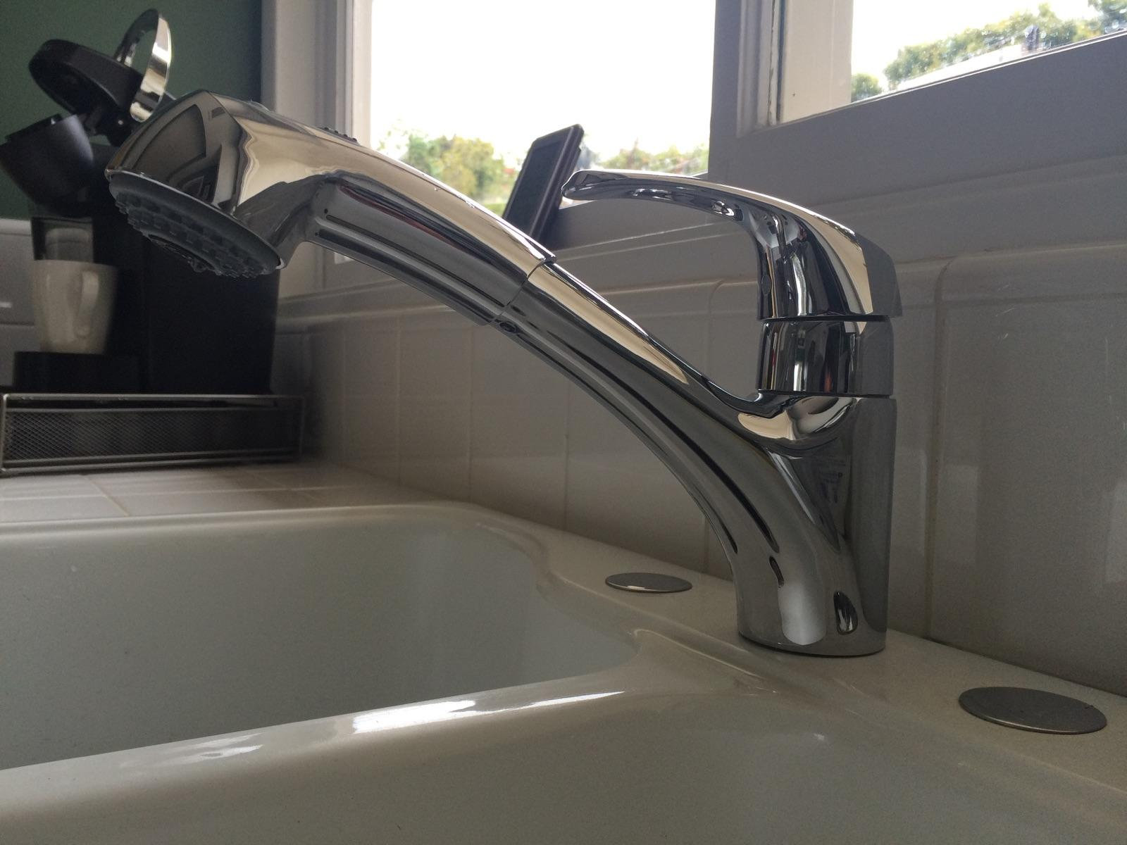 Chrome pull-out kitchen faucet installed